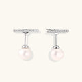 Rhodium-plated sterling silver ear jacket earrings with diamond-set horizontal bar and freshwater pearl drop