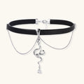 Black leather choker with white gold-plated serpent pendant adorned with zirconia crystals and teardrop charm