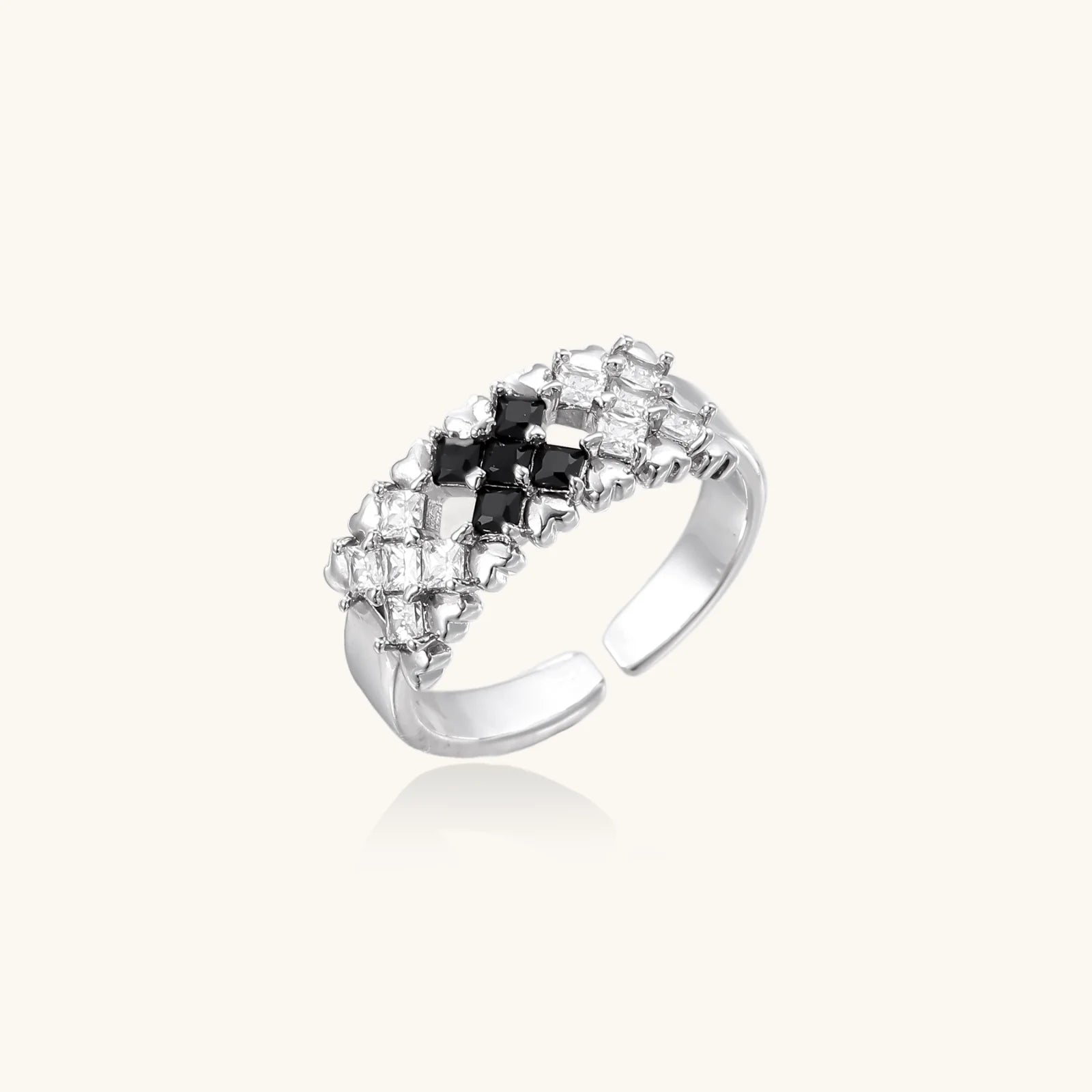 White gold plated adjustable ring with three rows of square zirconia stones in black or pink chevron pattern