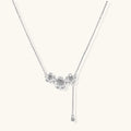 White gold plated Y-shaped necklace with three dimensional flower charms and adjustable drop pendant