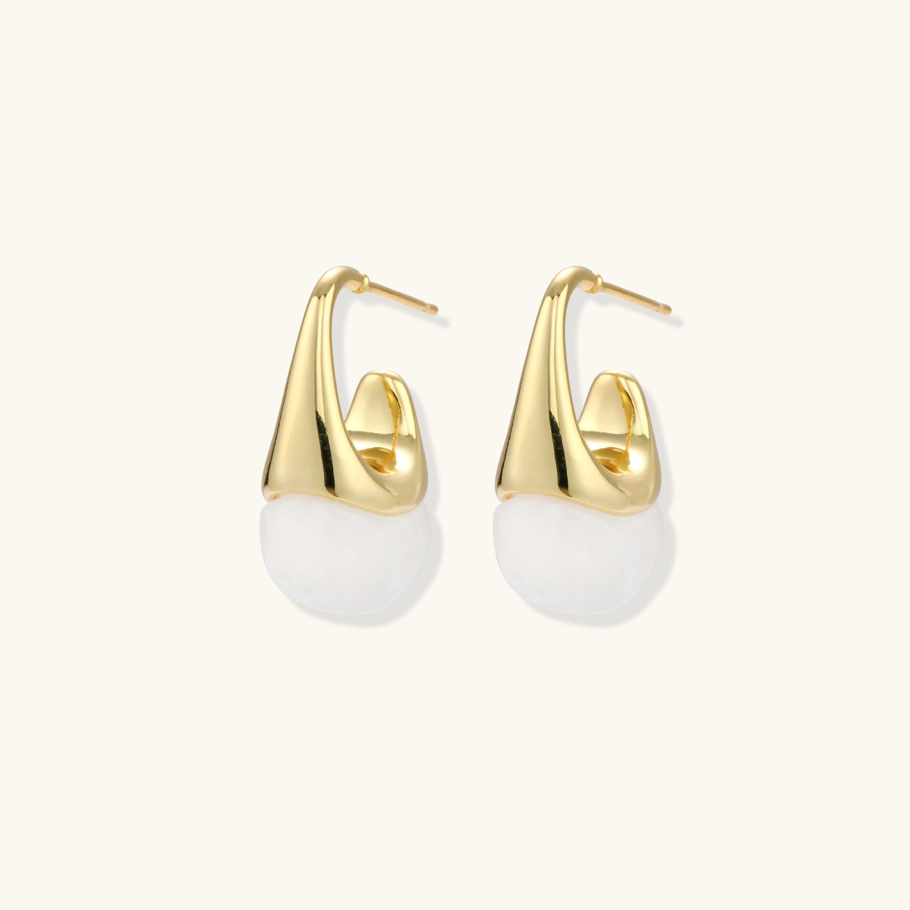 Pair of small gold-plated hoop earrings with triangular cone fronts and curved backs on white background.